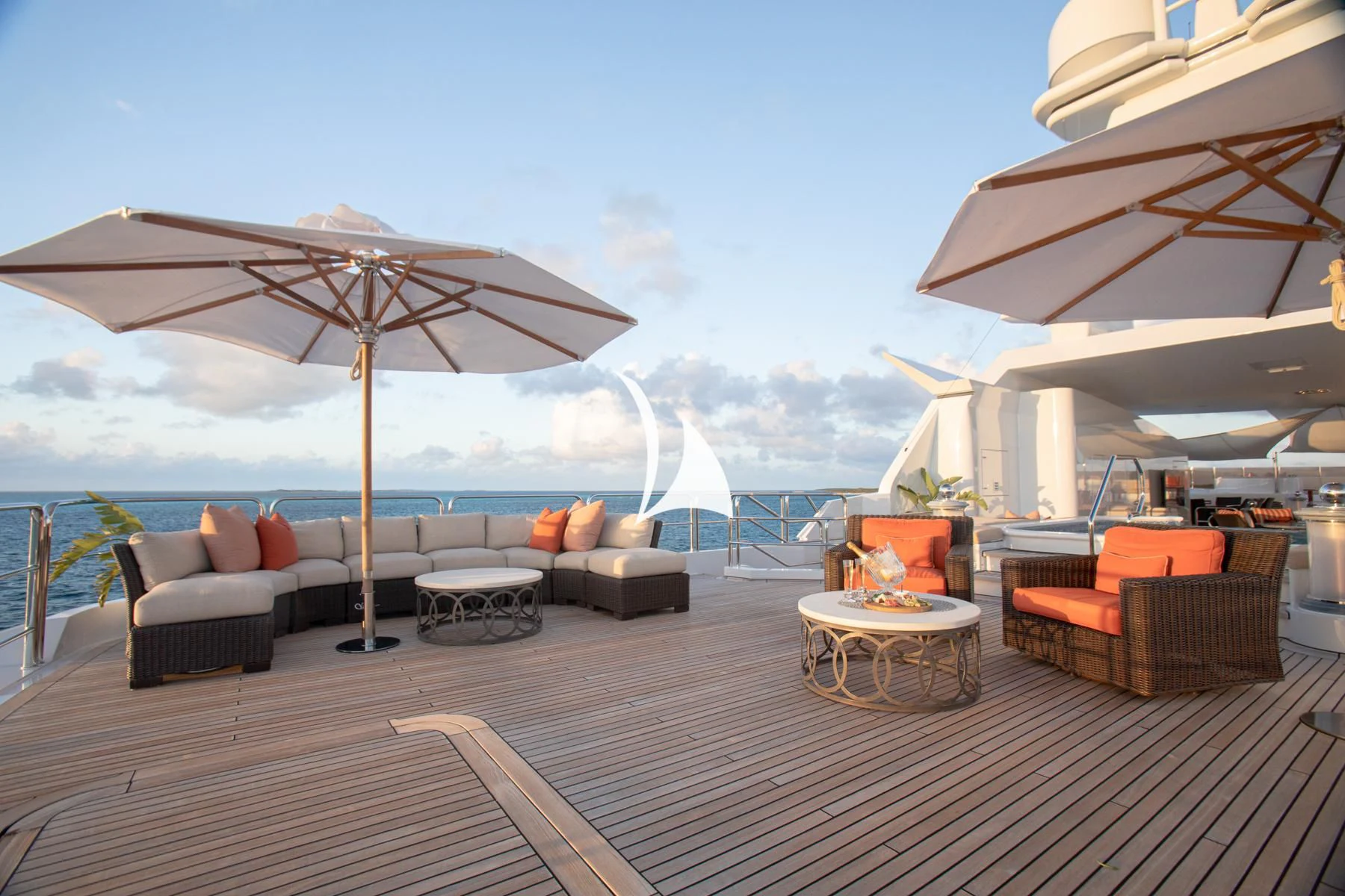 a deck with chairs and umbrellas aboard LUCKY LADY Yacht for Sale