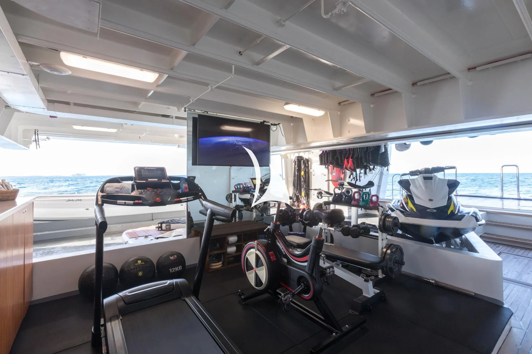 a group of treadmills in a room aboard LUCKY LADY Yacht for Sale