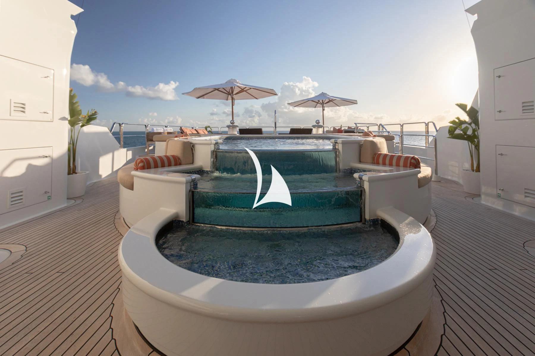 a pool with a large umbrella aboard LUCKY LADY Yacht for Sale