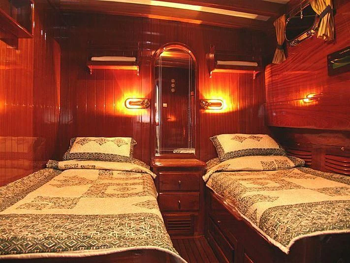 a room with two beds aboard AGANIPPE Yacht for Sale