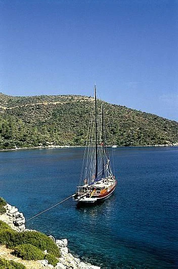 a boat sailing on the water aboard AGANIPPE Yacht for Sale