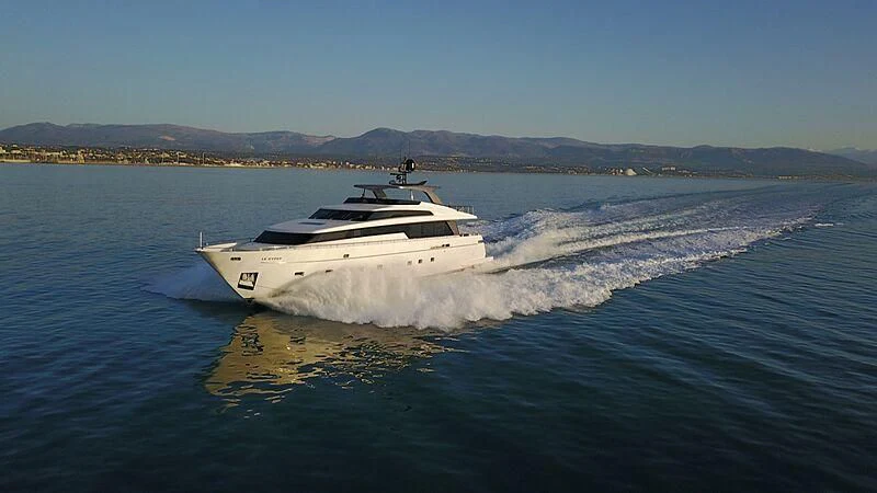 a white boat on water aboard EMY Yacht for Sale