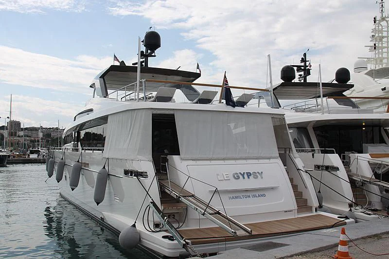 a boat docked at a pier aboard EMY Yacht for Sale