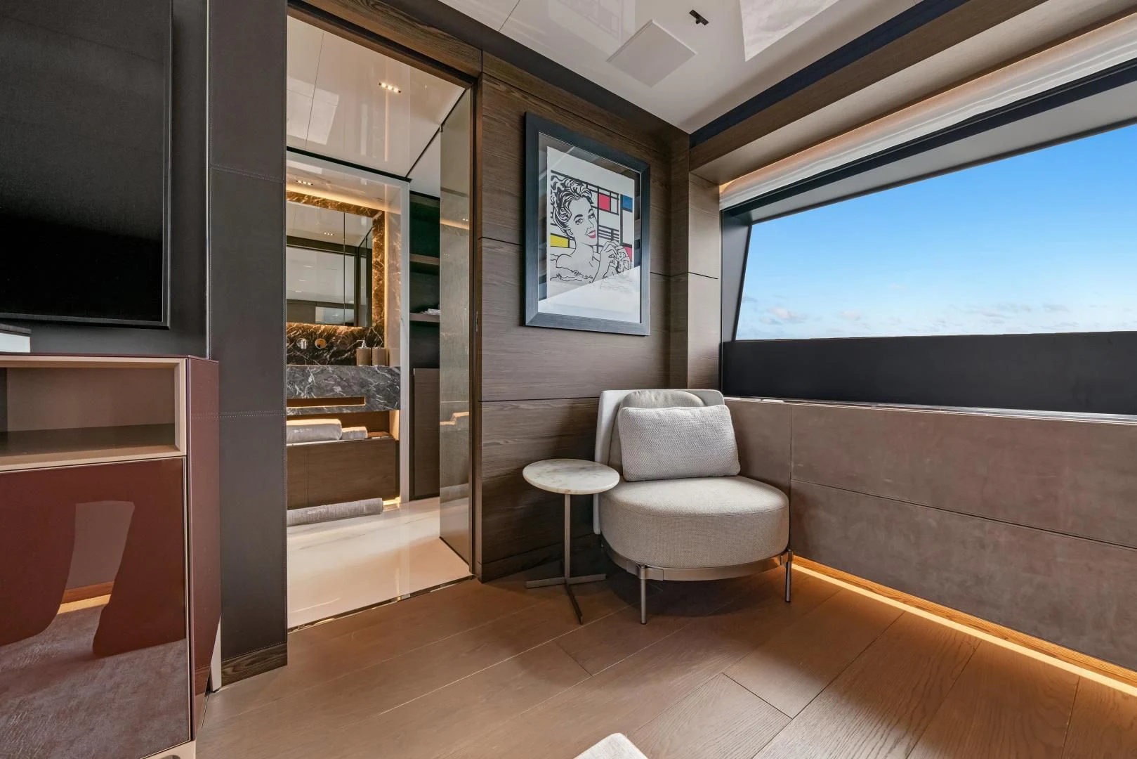a room with a chair and a table and a tv aboard ASANTE Yacht for Sale