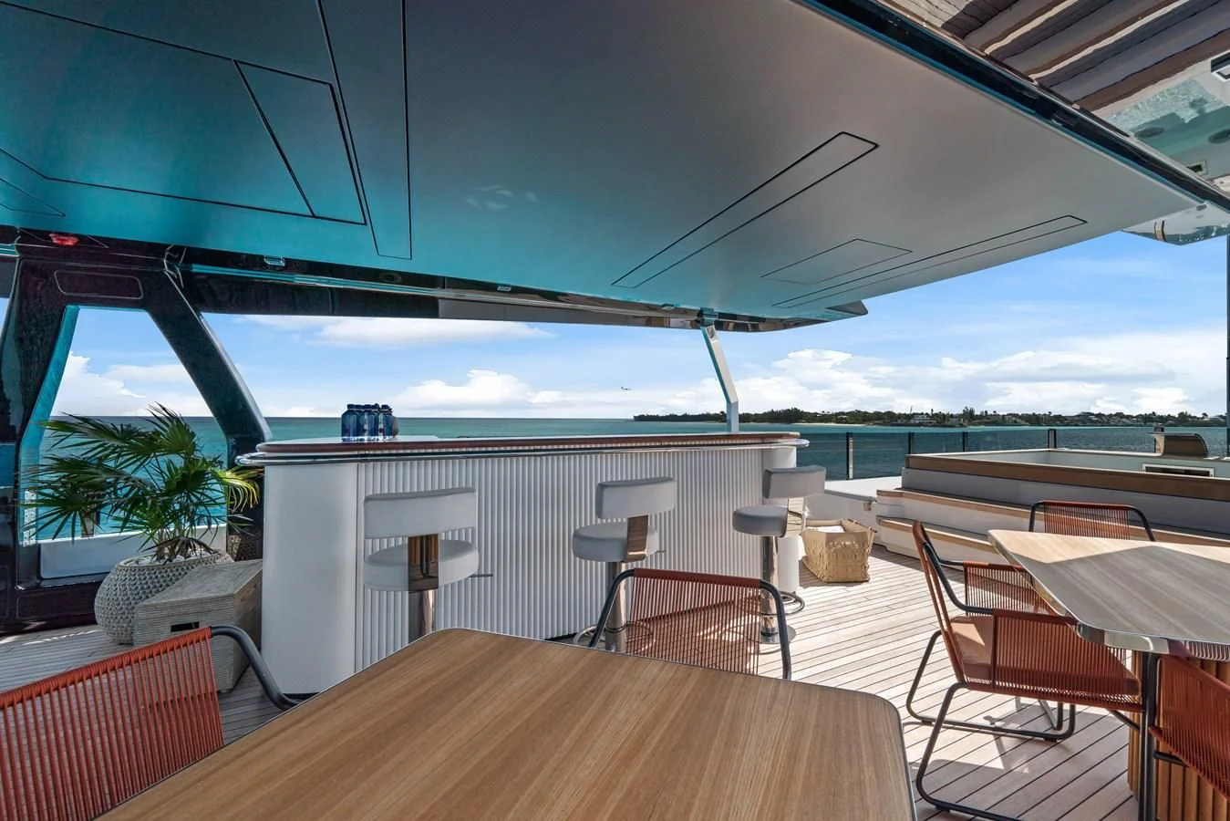 a room with tables and chairs aboard ASANTE Yacht for Sale