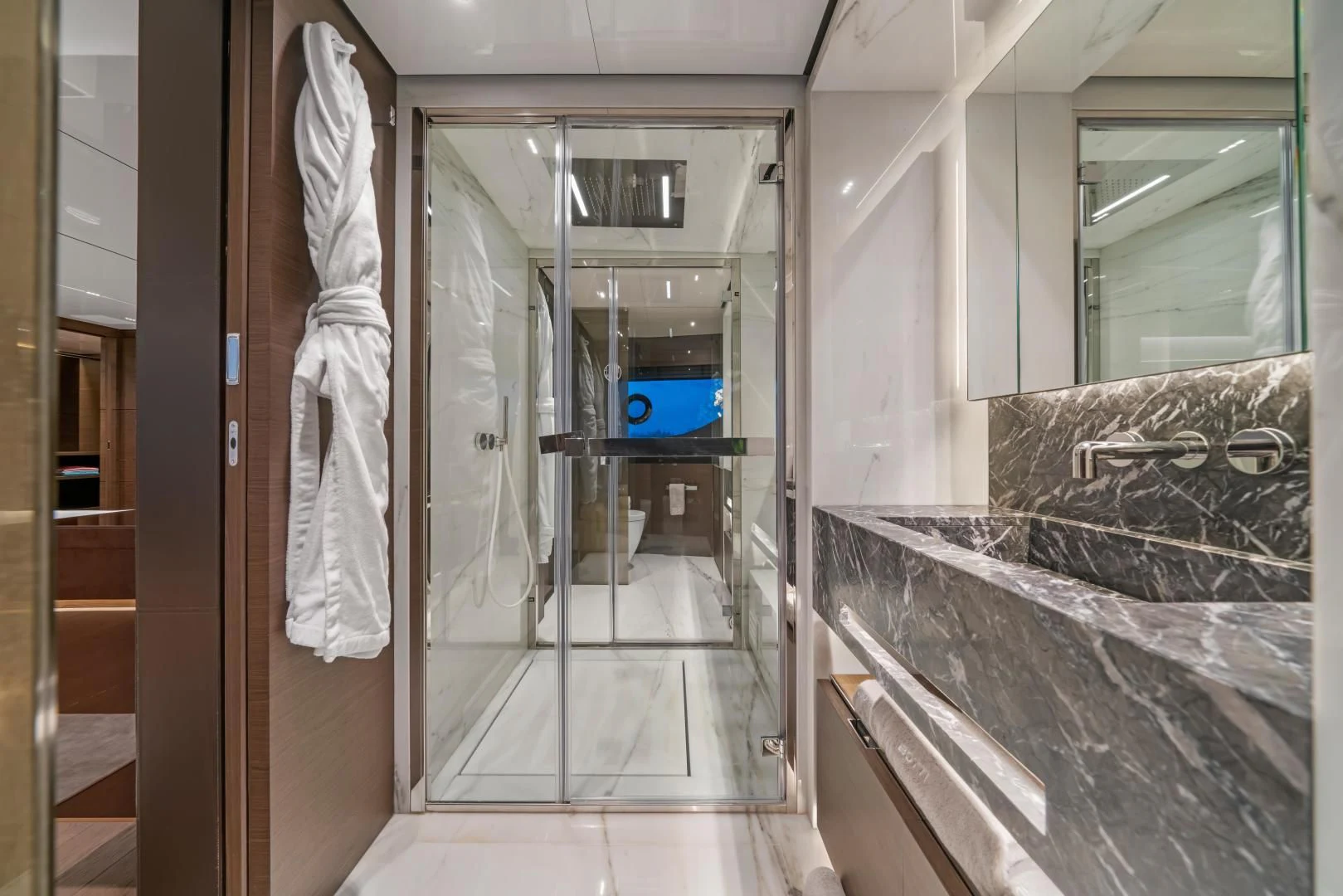a bathroom with a glass shower aboard ASANTE Yacht for Sale