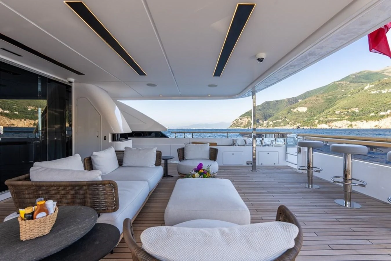 a living room with a large deck aboard ASANTE Yacht for Sale