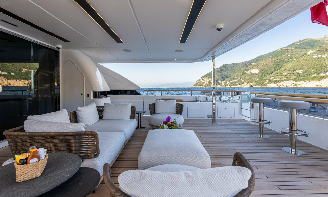 a living room with a large deck aboard ASANTE Yacht for Sale