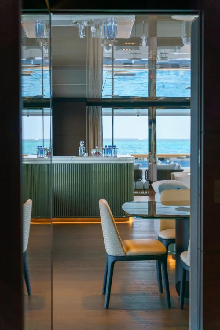 a room with a table and chairs aboard ASANTE Yacht for Sale