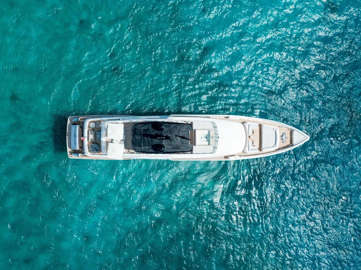 a silver and white boat in the water aboard ASANTE Yacht for Sale