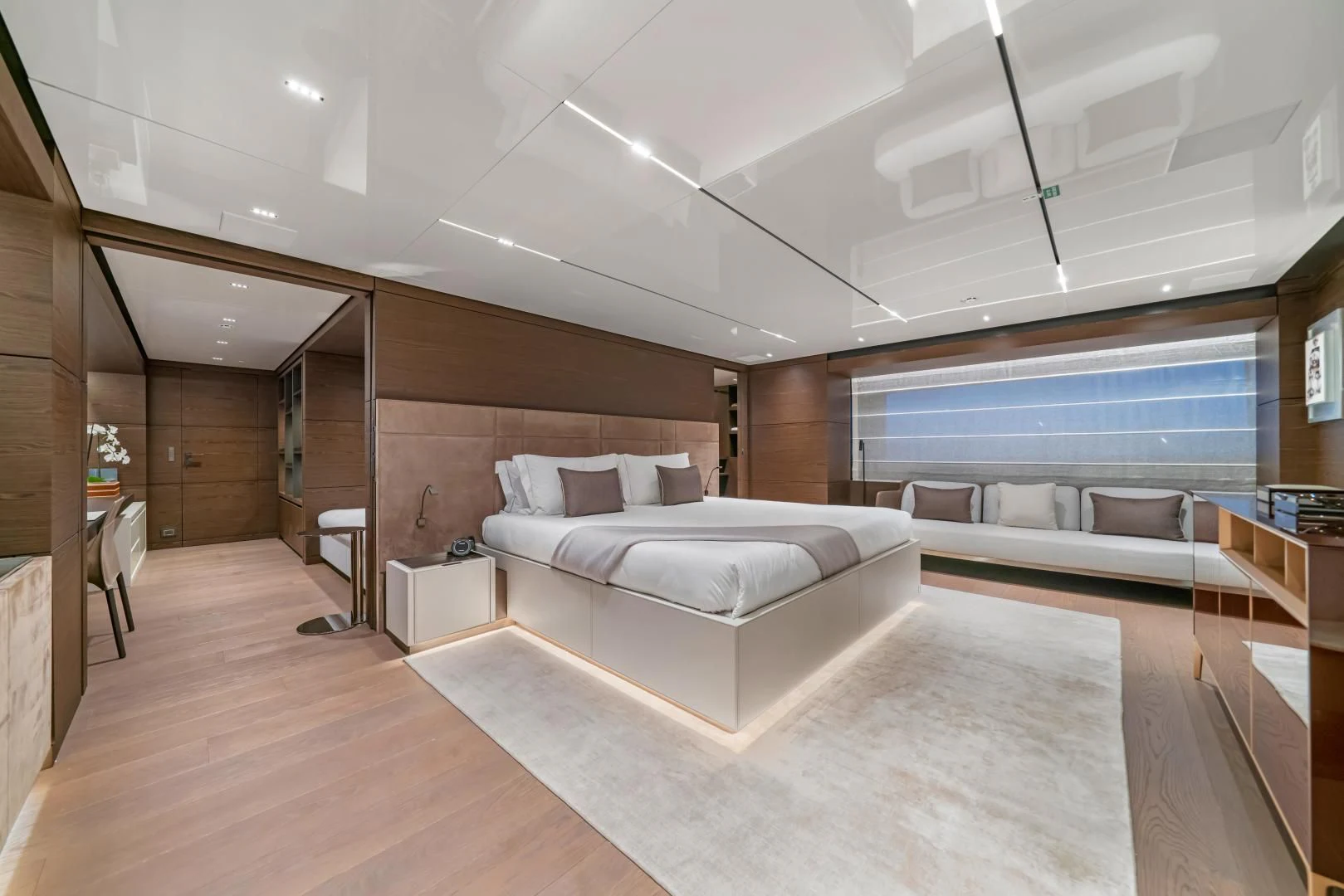 a large room with a bed and a large window aboard ASANTE Yacht for Sale