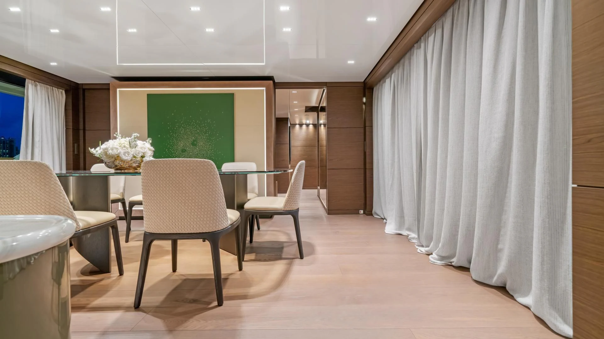 a room with a table chairs and a green screen aboard ASANTE Yacht for Sale