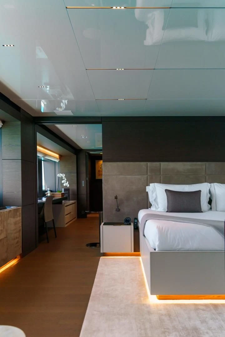 a room with a bed and a desk aboard ASANTE Yacht for Sale