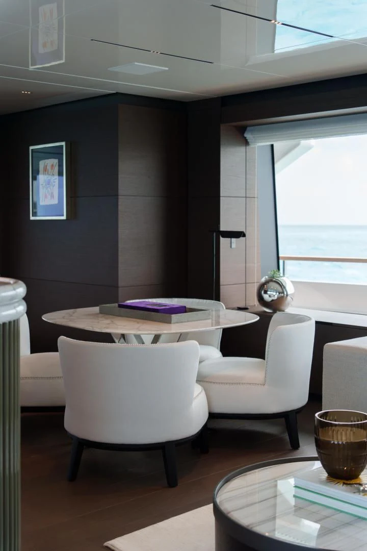 a room with a table and chairs aboard ASANTE Yacht for Sale