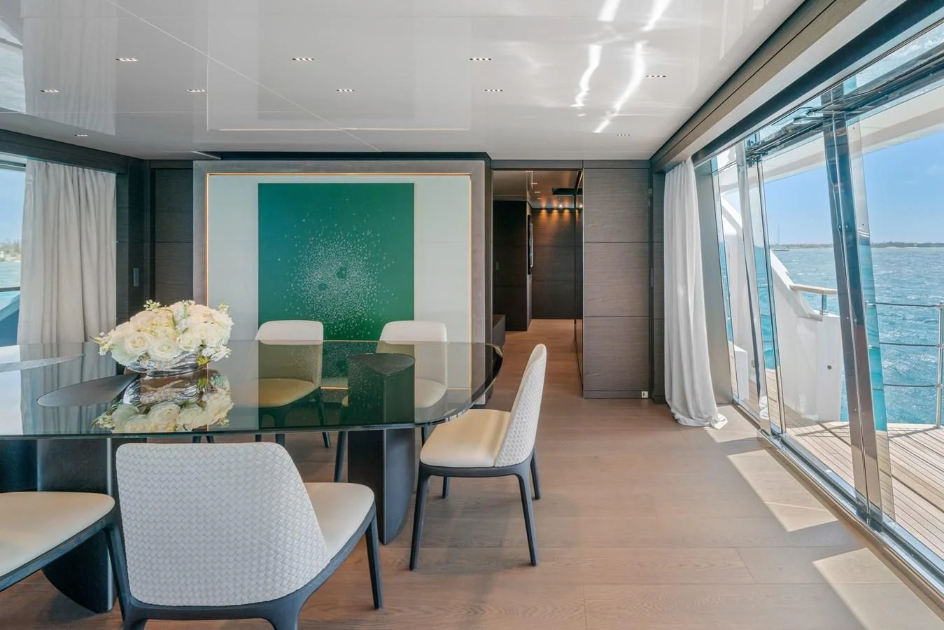 a room with tables and chairs aboard ASANTE Yacht for Sale