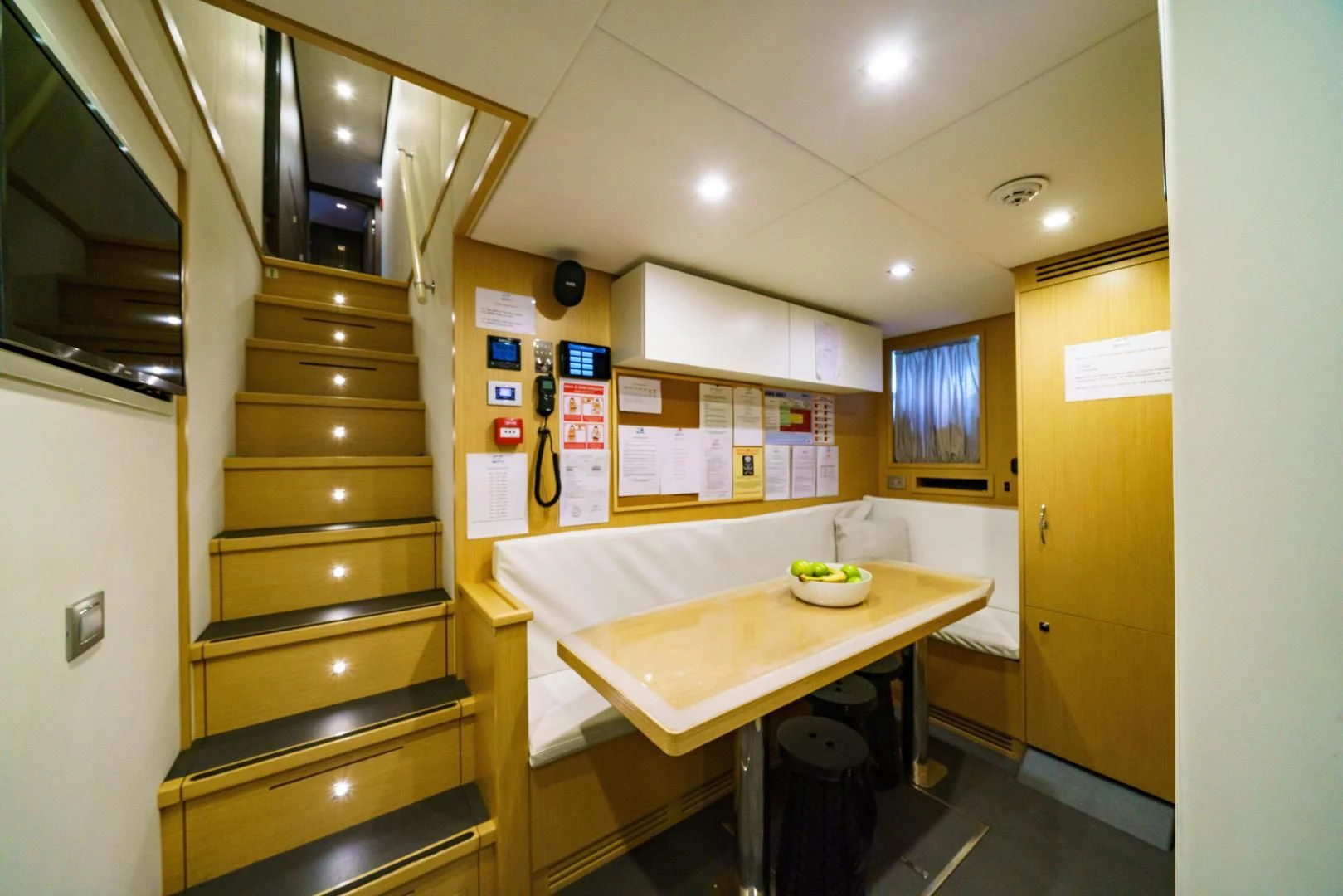 a kitchen with a table and cabinets aboard ASANTE Yacht for Sale