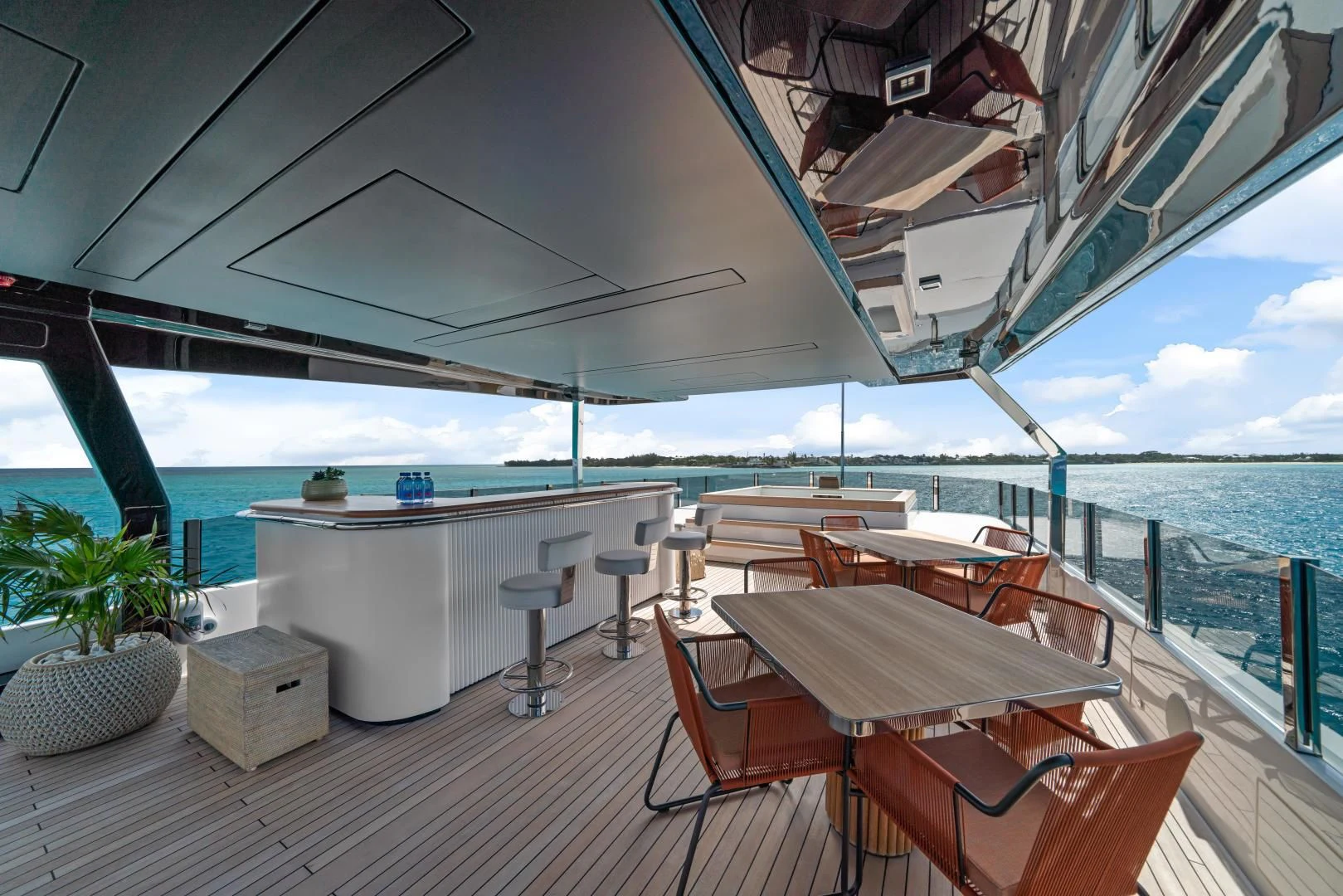 a deck with a table and chairs on it aboard ASANTE Yacht for Sale