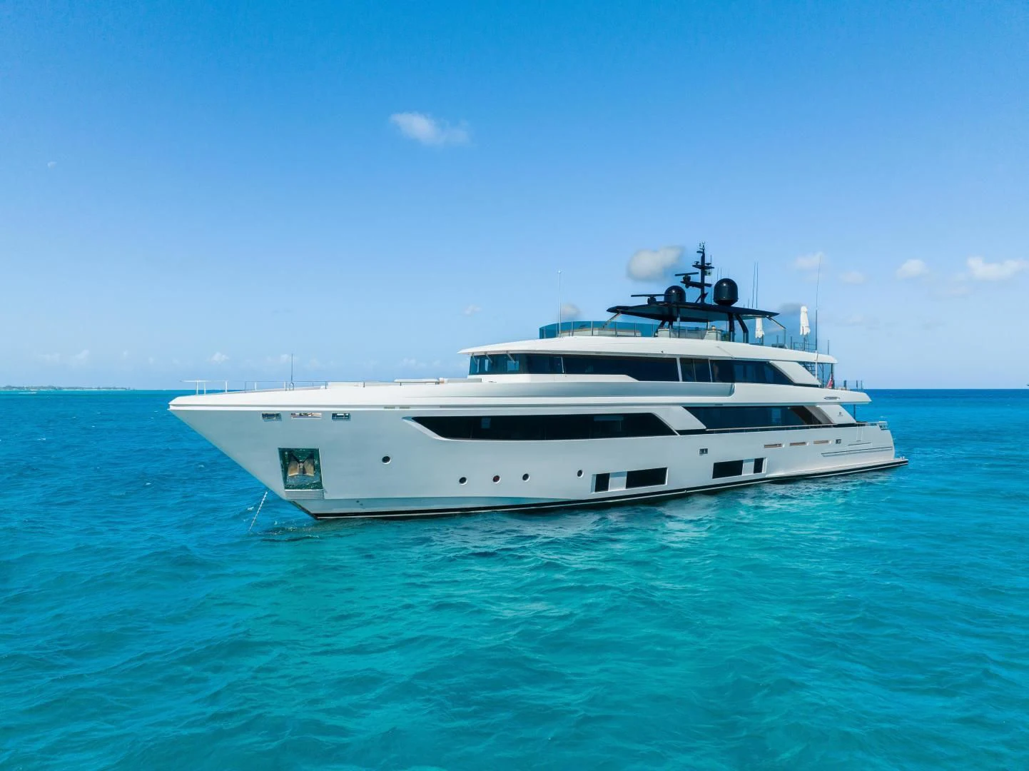 a white yacht in the water aboard ASANTE Yacht for Sale