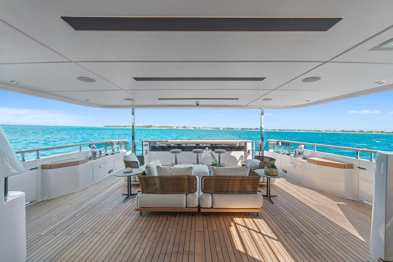 a room with a deck and chairs aboard ASANTE Yacht for Sale