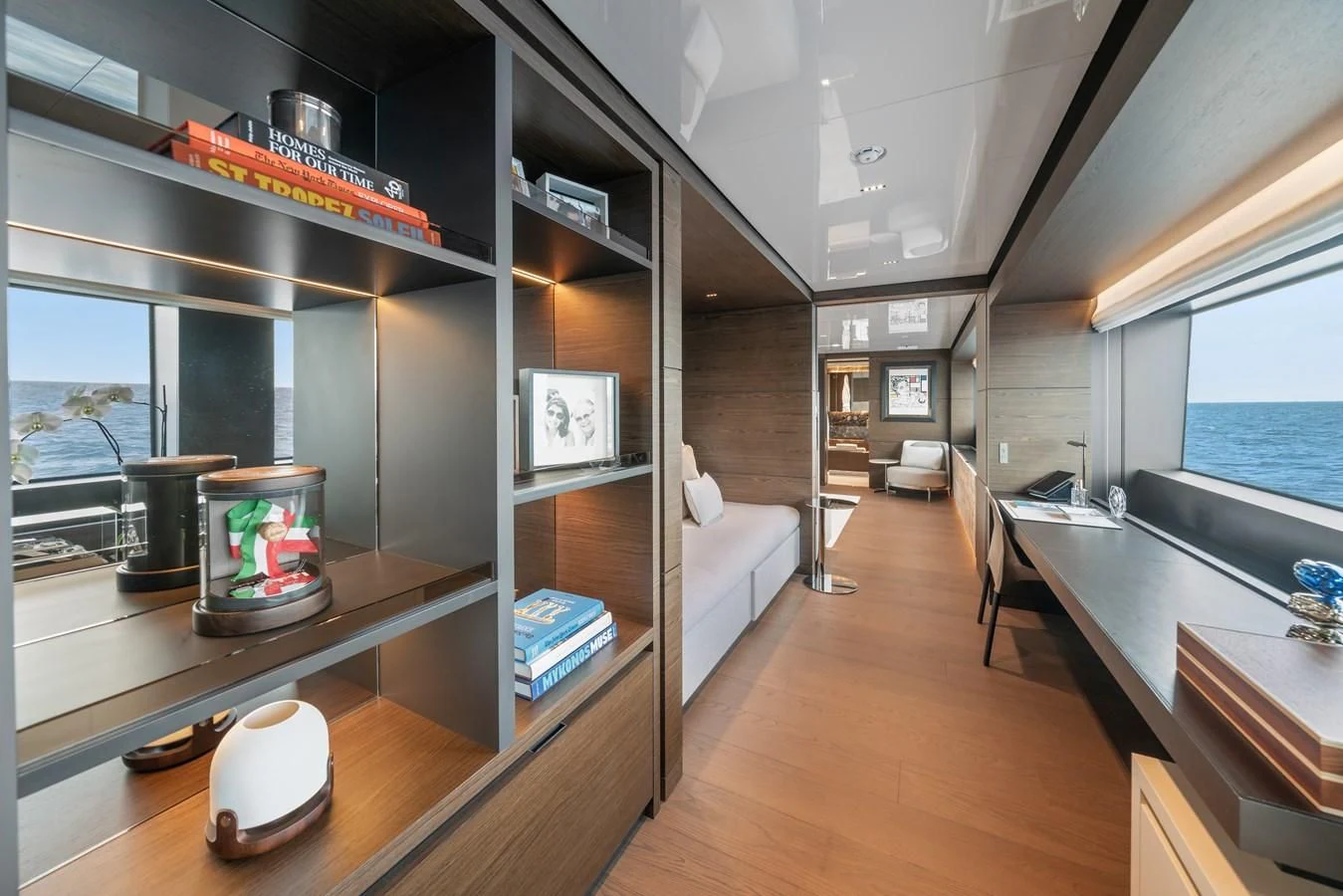 a room with a large window and a table with chairs and a tv aboard ASANTE Yacht for Sale