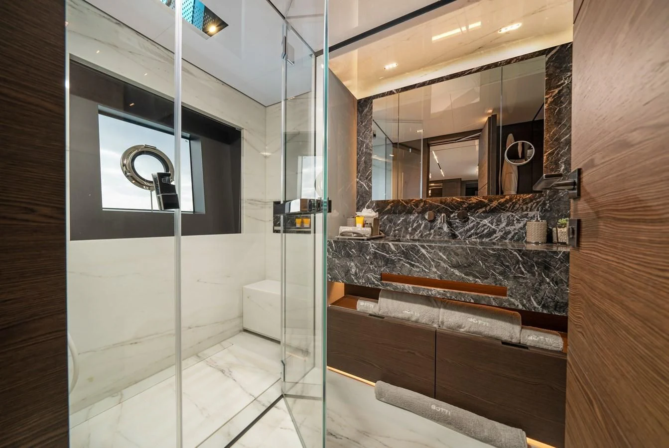 a bathroom with a glass shower aboard ASANTE Yacht for Sale