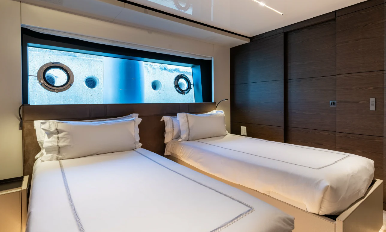 a couple of beds in a room aboard ASANTE Yacht for Sale