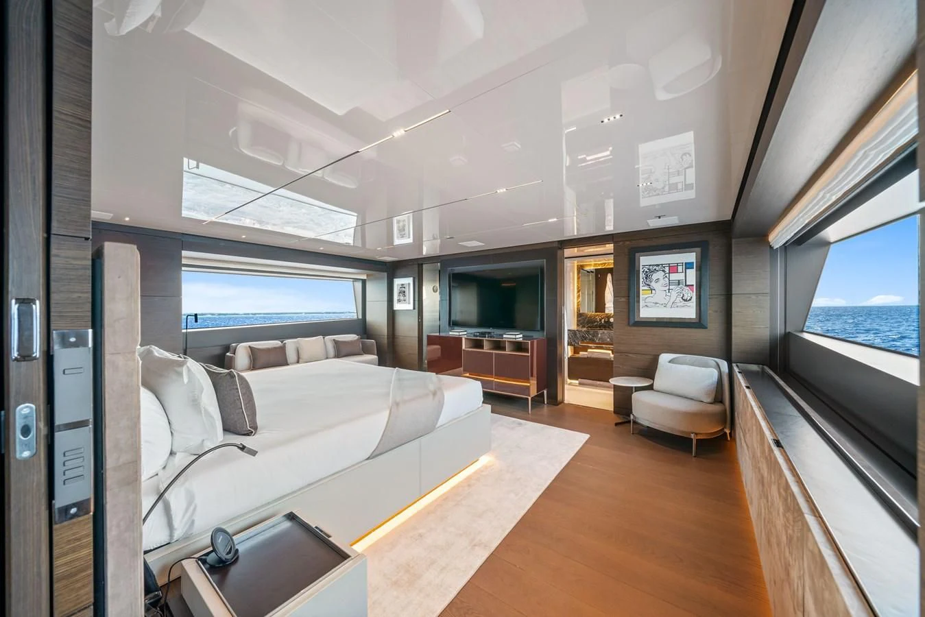 a room with a bed and a couch aboard ASANTE Yacht for Sale