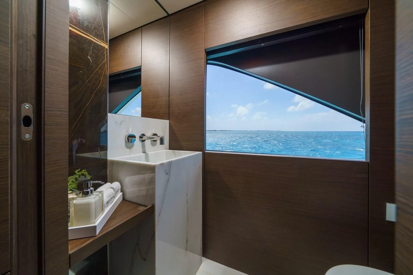 a bathroom with a large window aboard ASANTE Yacht for Sale