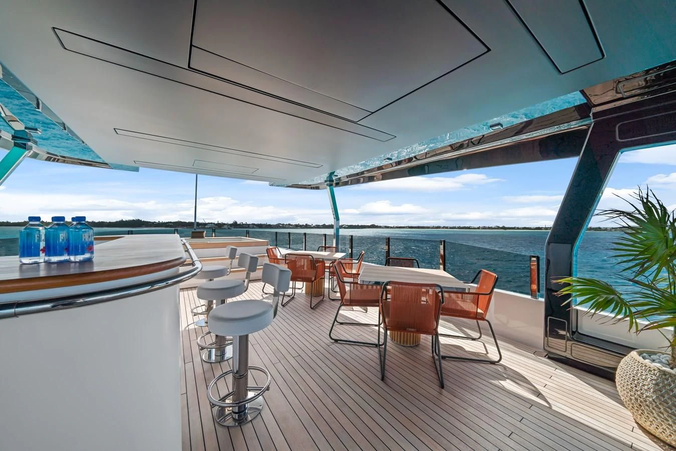 a room with tables and chairs aboard ASANTE Yacht for Sale