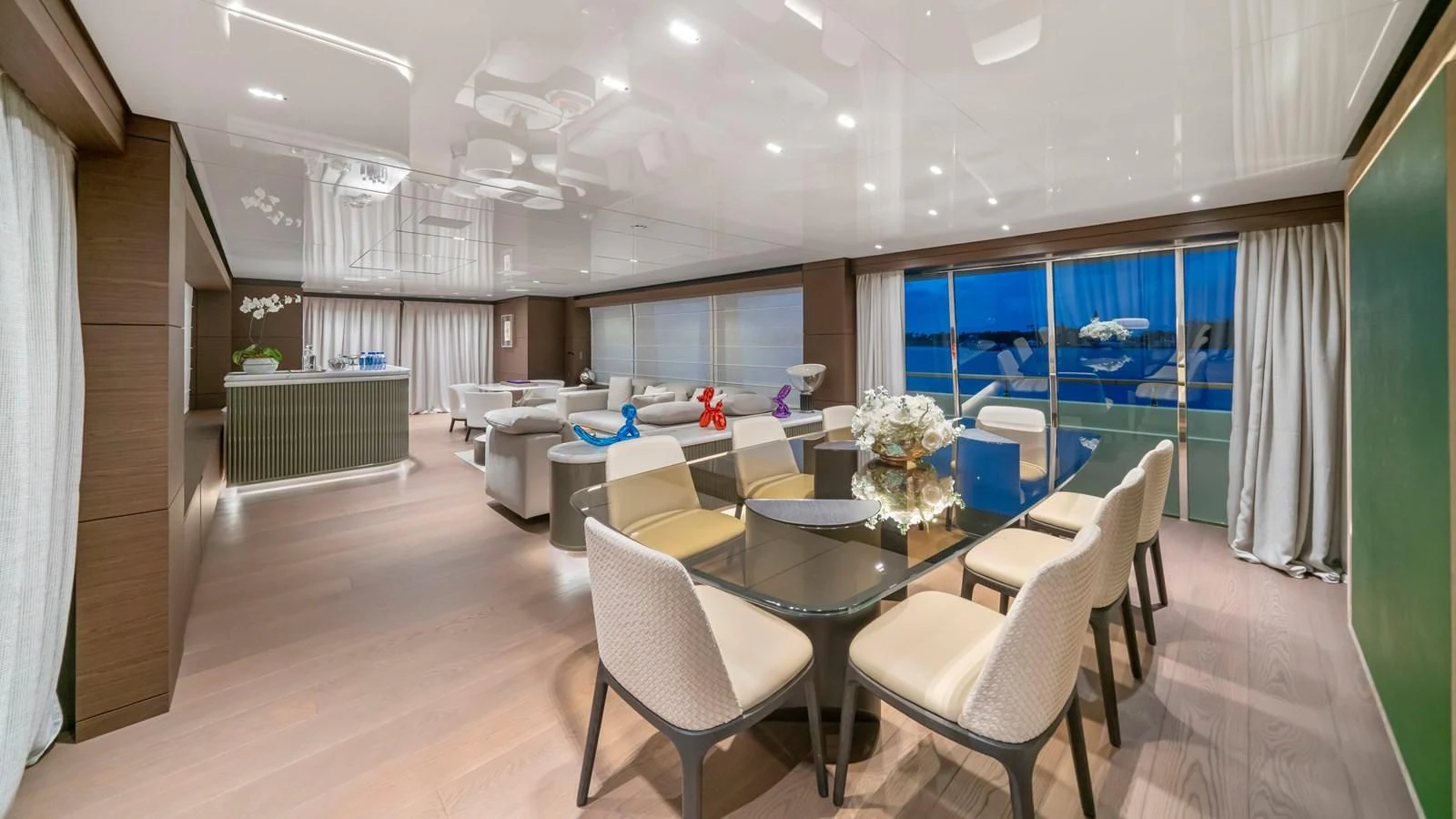 a large room with a table and chairs aboard ASANTE Yacht for Sale