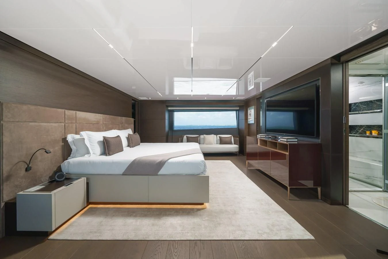 a room with a bed and a tv aboard ASANTE Yacht for Sale