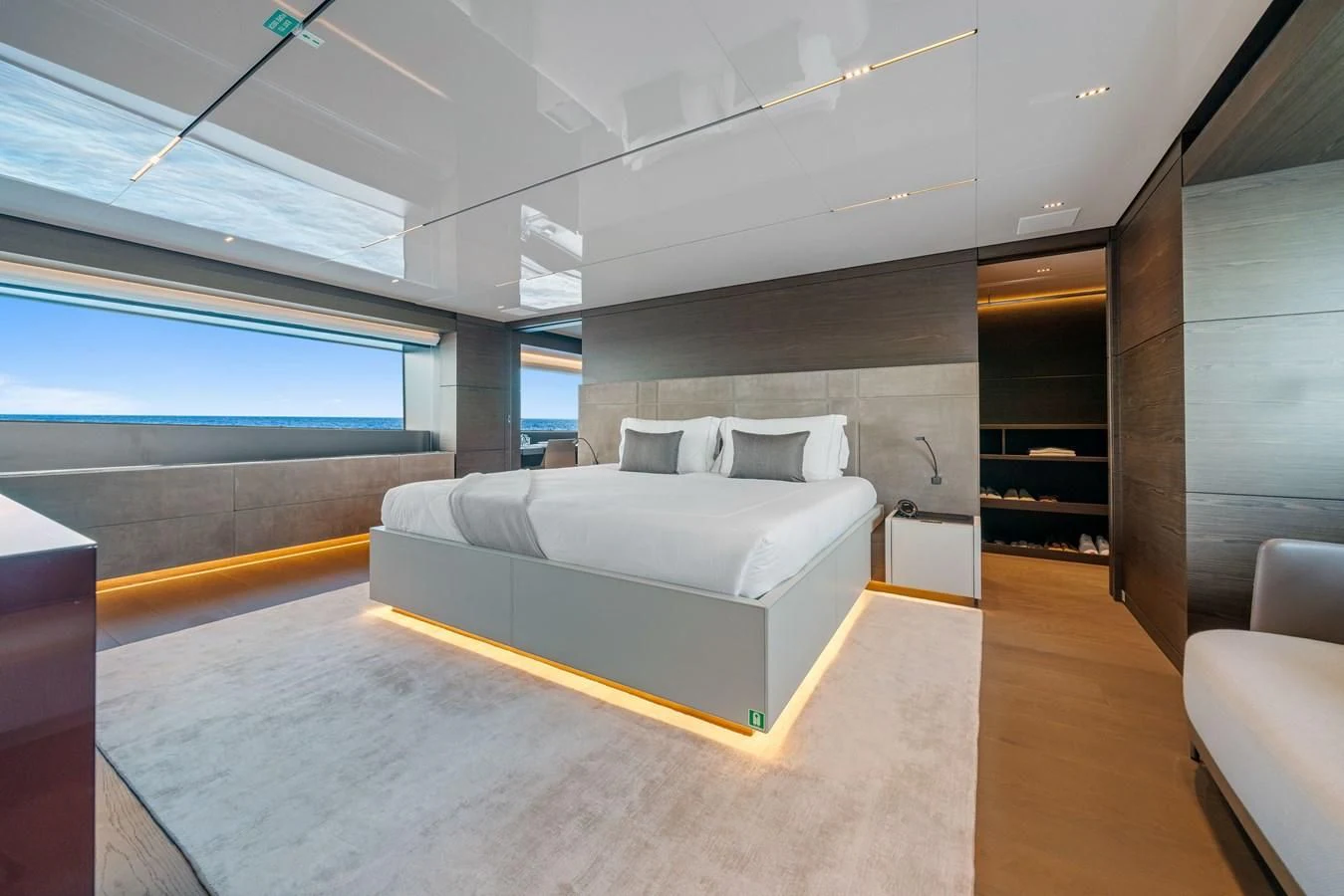a room with a bed and a couch aboard ASANTE Yacht for Sale