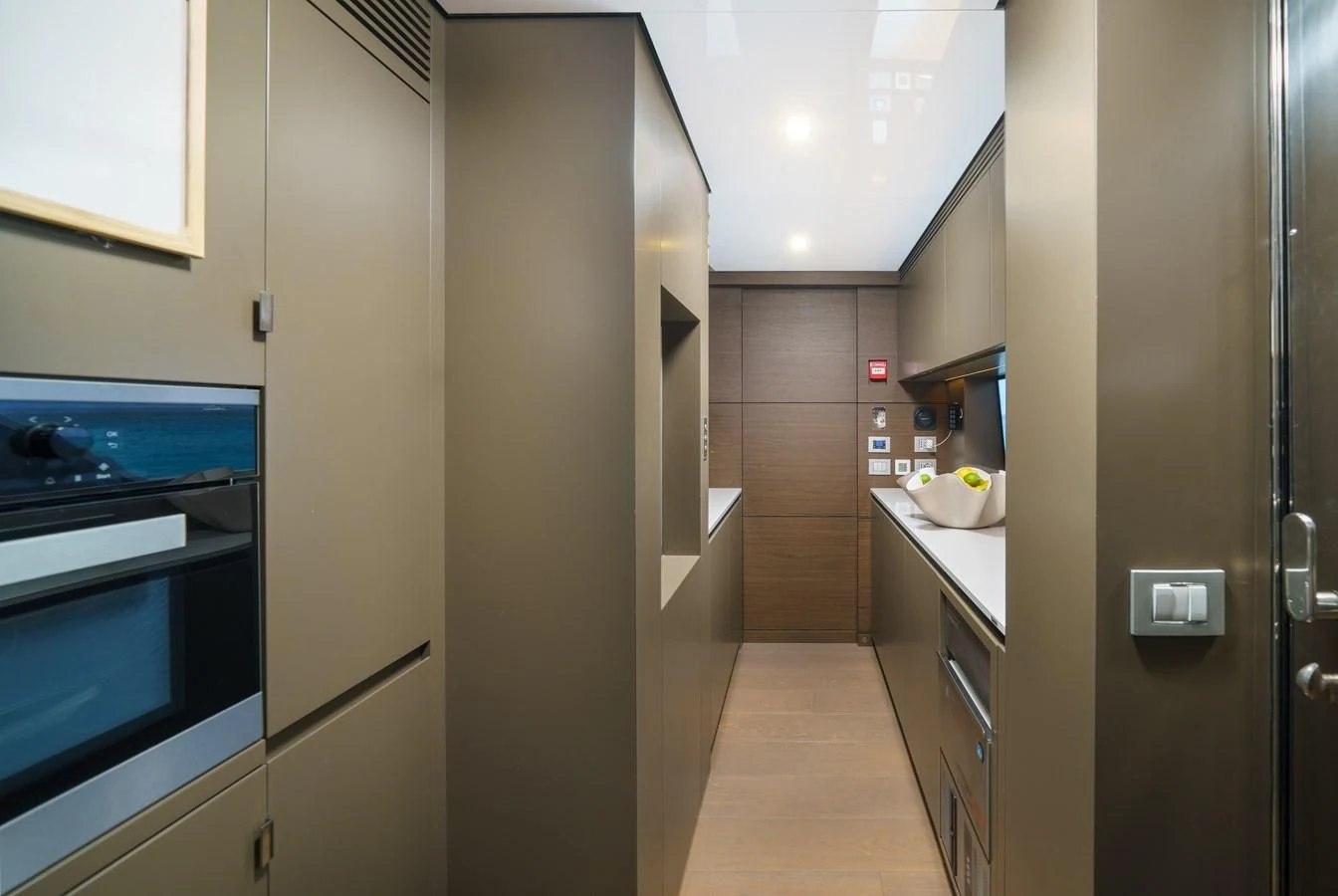 a kitchen with a large refrigerator aboard ASANTE Yacht for Sale