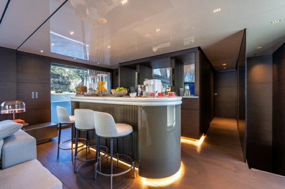 a kitchen with a table and chairs aboard ASANTE Yacht for Sale
