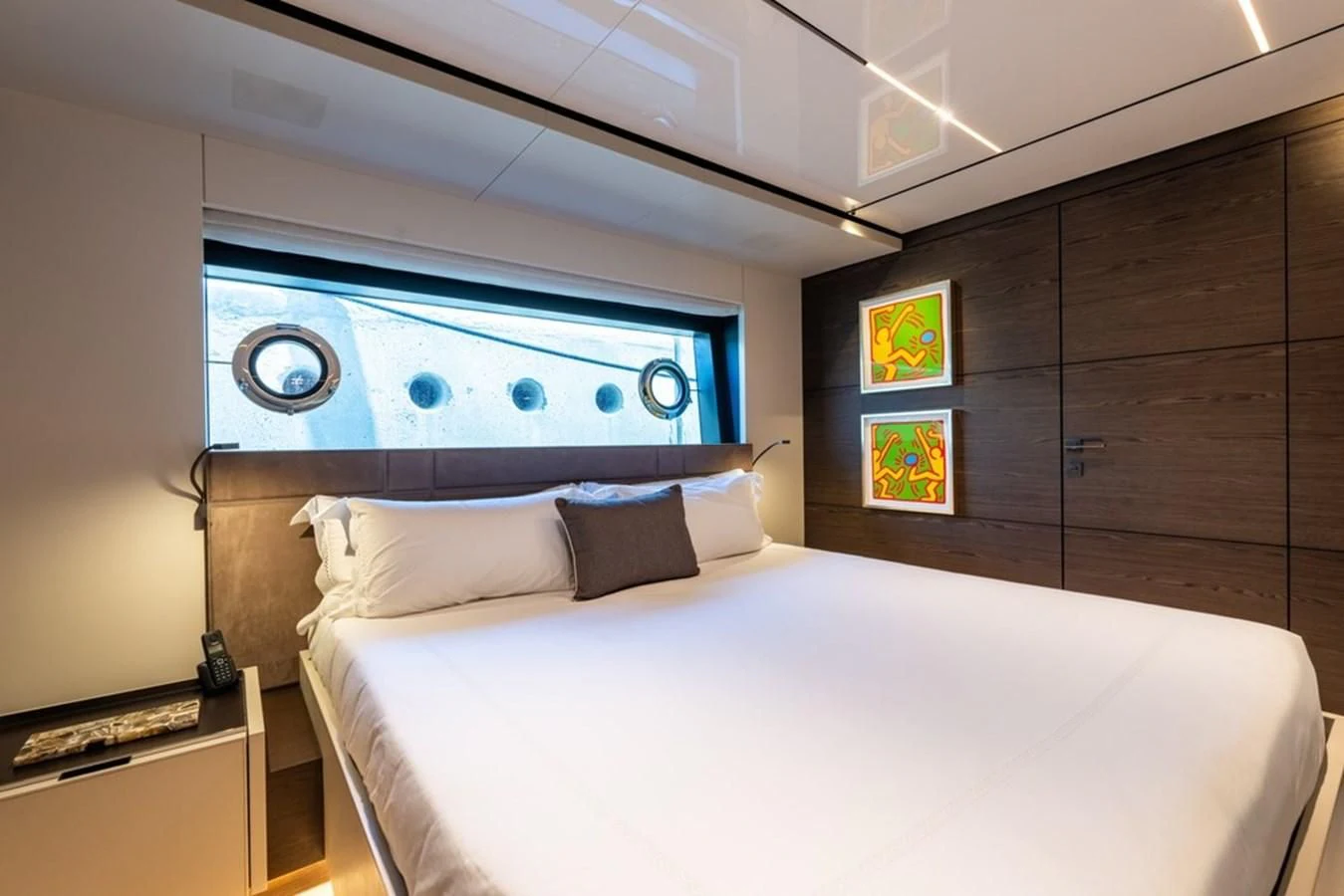 a bed with a white bed aboard ASANTE Yacht for Sale