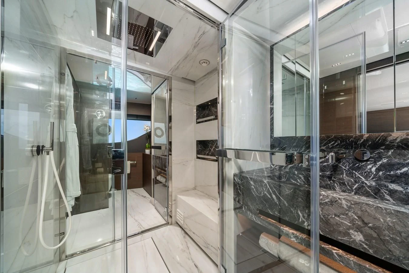 a large bathroom with glass walls aboard ASANTE Yacht for Sale