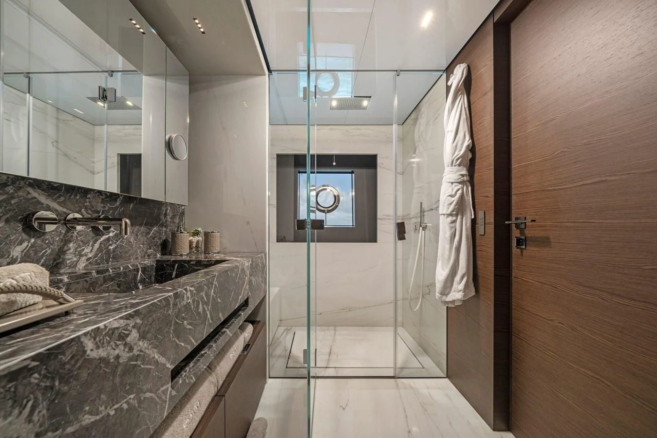 a bathroom with a glass shower aboard ASANTE Yacht for Sale