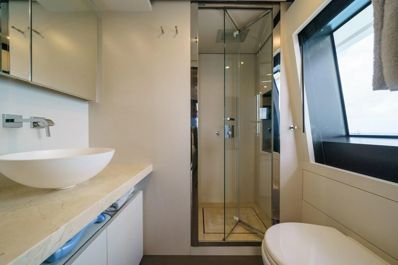 a bathroom with a glass shower aboard ASANTE Yacht for Sale