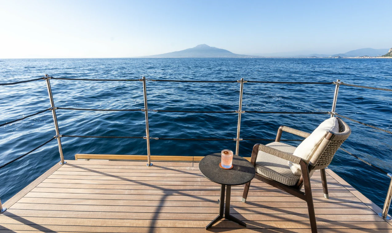 a couple chairs on a dock by the water aboard ASANTE Yacht for Sale