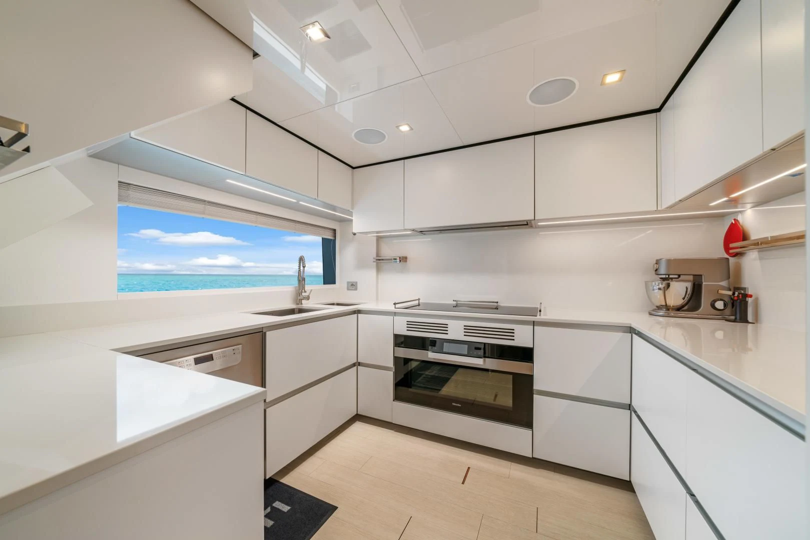 a kitchen with white cabinets aboard ASANTE Yacht for Sale