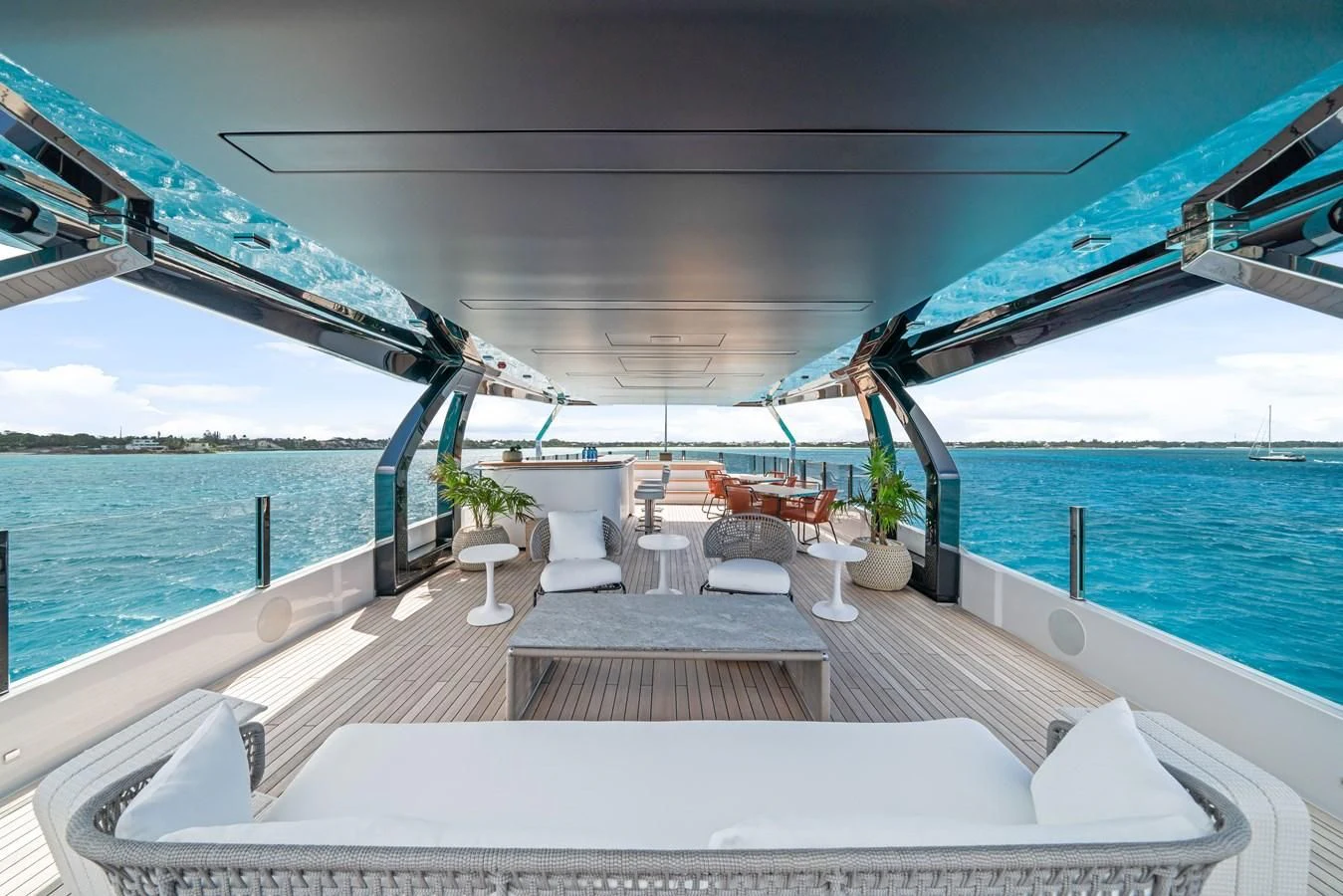 a deck with a view of the ocean and the ocean aboard ASANTE Yacht for Sale