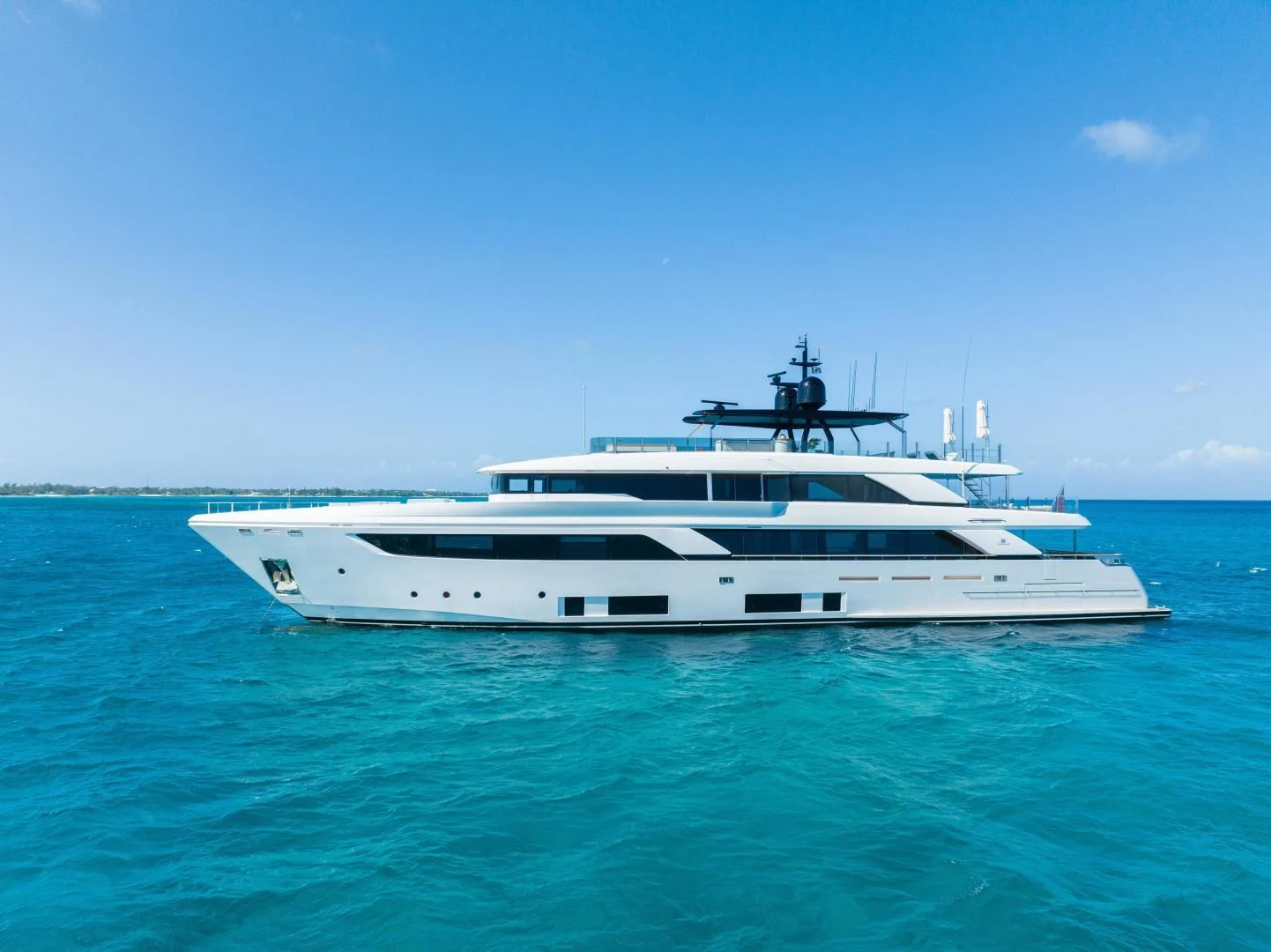 a white yacht in the water aboard ASANTE Yacht for Sale