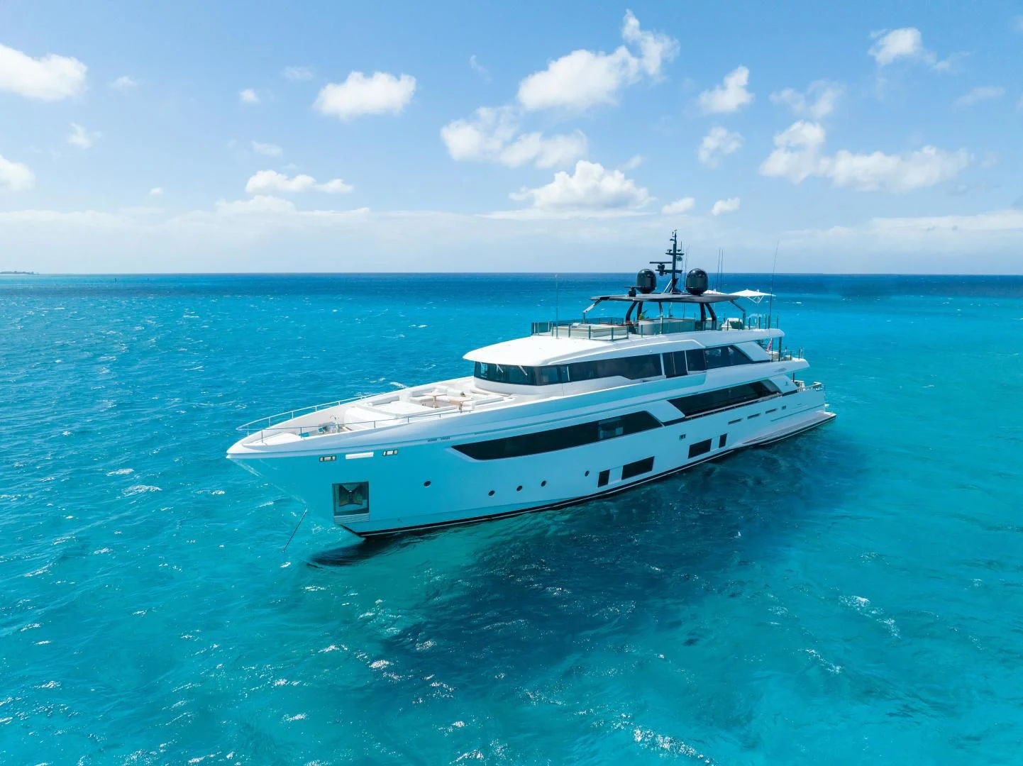 a white yacht in the water aboard ASANTE Yacht for Sale