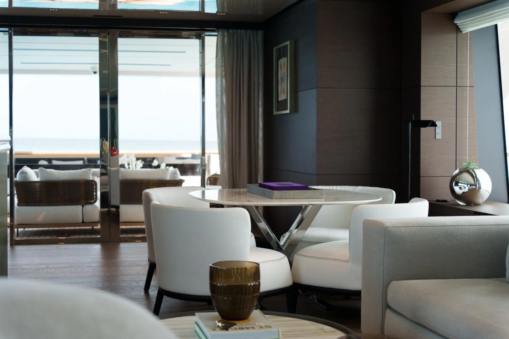 a room with a table chairs and a window aboard ASANTE Yacht for Sale