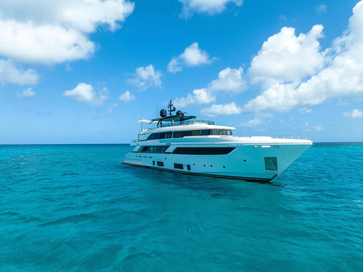 a white boat in the water aboard ASANTE Yacht for Sale