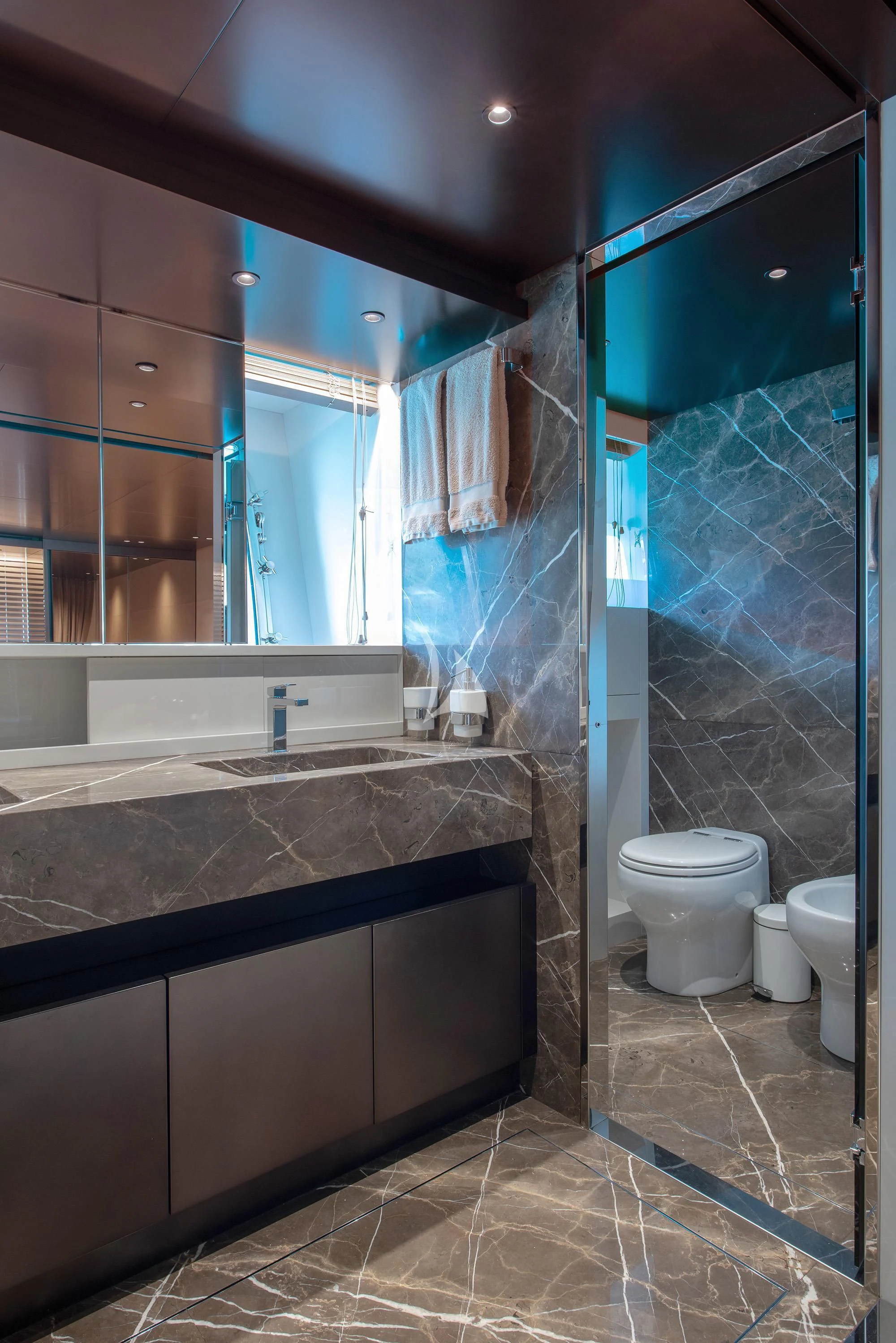 a bathroom with a glass shower aboard TIBERIAS Yacht for Sale