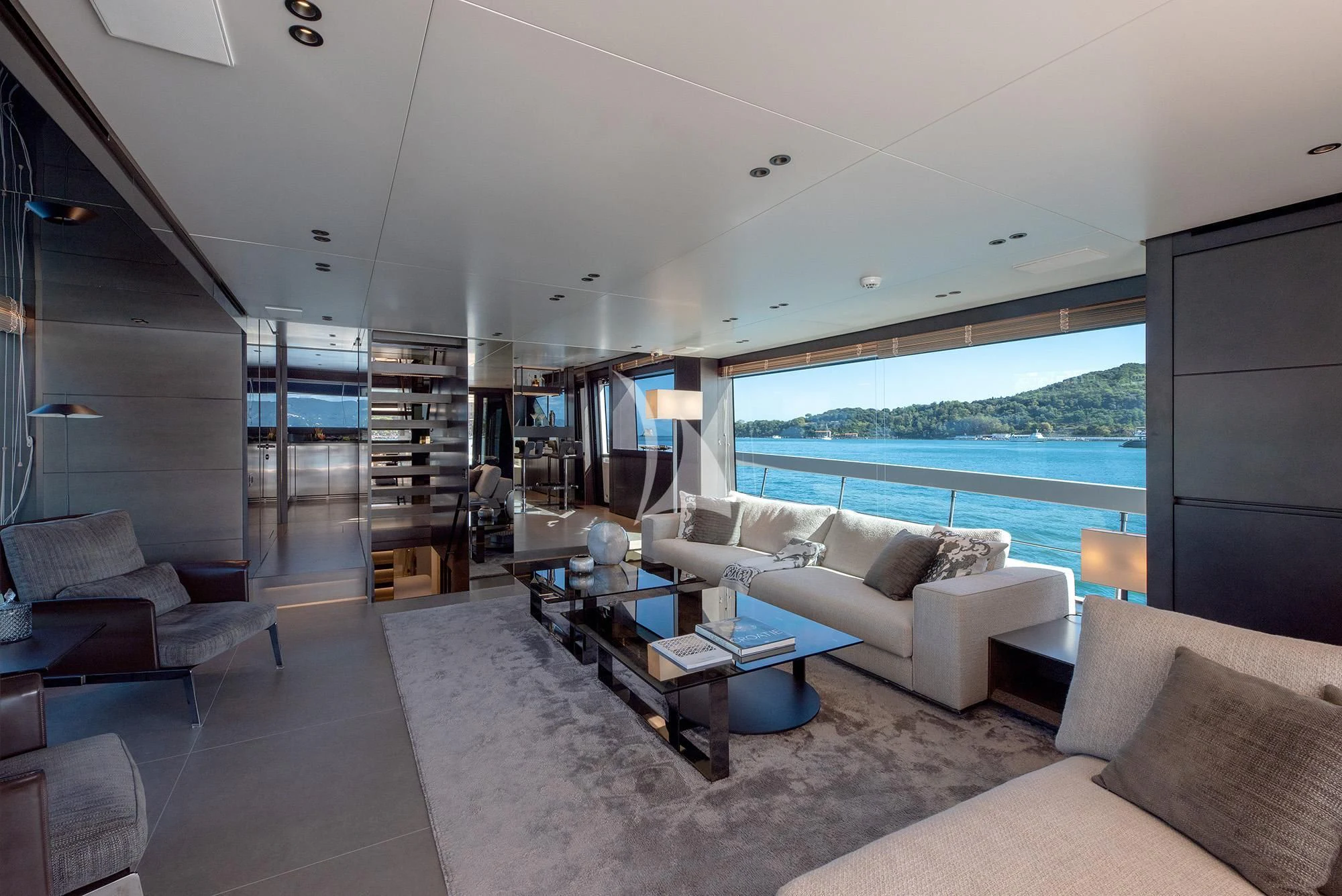 a living room with a large window aboard TIBERIAS Yacht for Sale