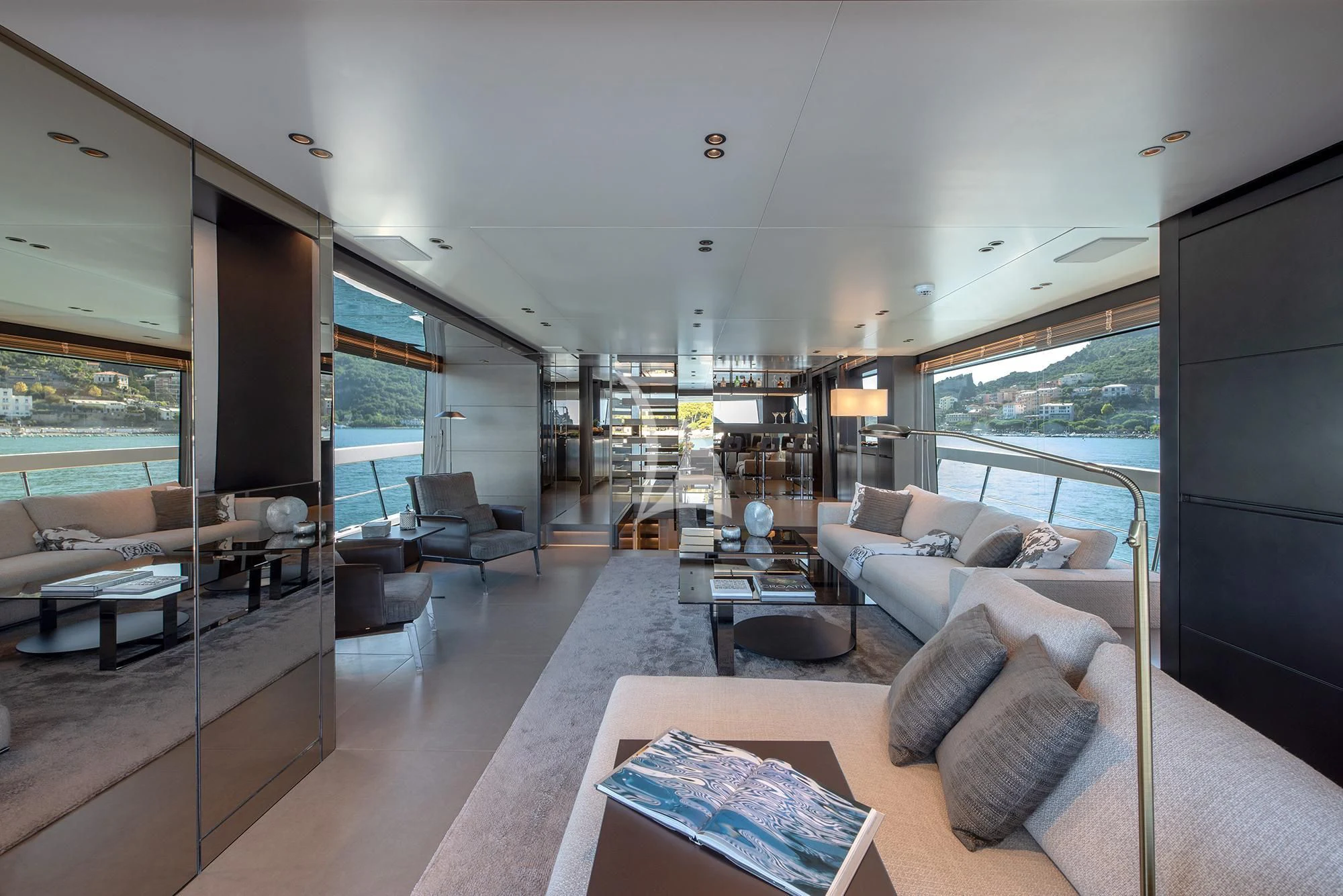 a living room with a large window aboard TIBERIAS Yacht for Sale