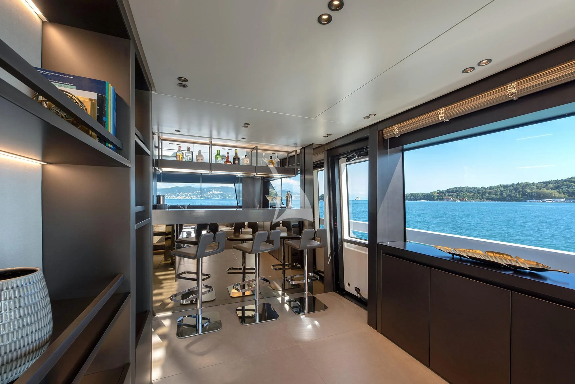 inside of a building with a large window and a view of the water aboard TIBERIAS Yacht for Sale