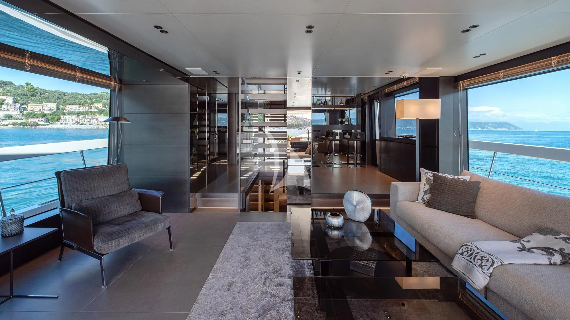 a living room with a large window aboard TIBERIAS Yacht for Sale